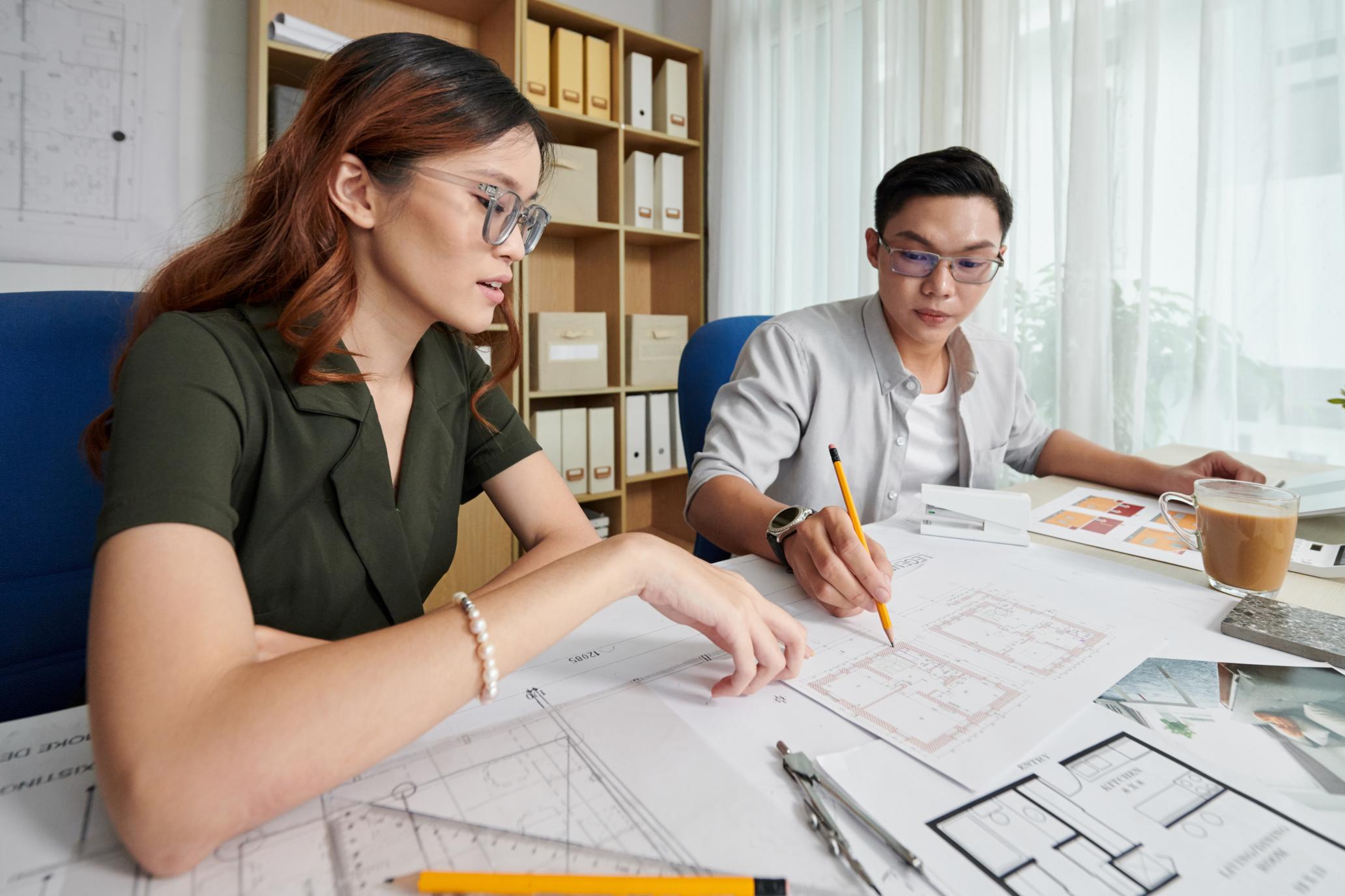 architects-discussing-building-blueprint
