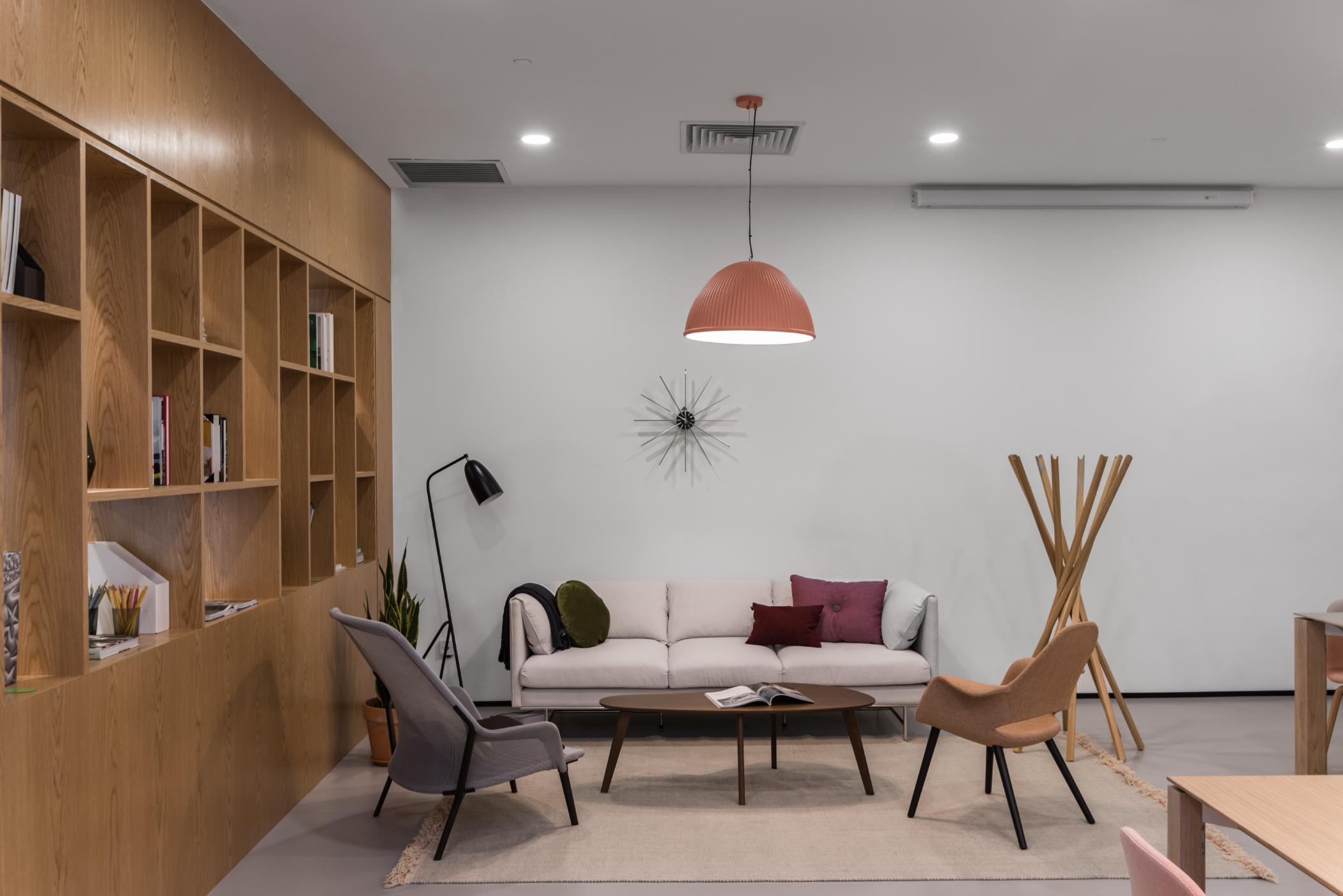 cozy-lounge-area-sofa-clock-wooden-shelves