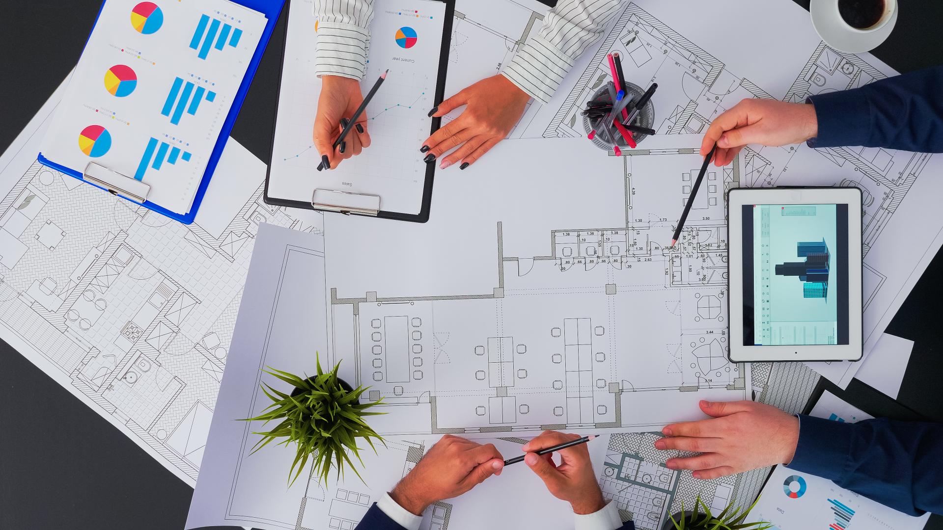 engineers-creating-a-blueprint-in-boardroom